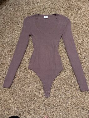 Abercrombie & Fitch Ribbed Long-Sleeve One-Piece Bodysuit in Mauve